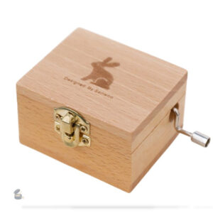 Boîte à musique manivelle avec motif de lapin